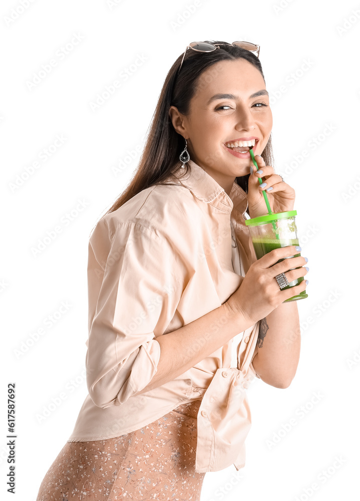 Young woman with glass of vegetable juice on white background