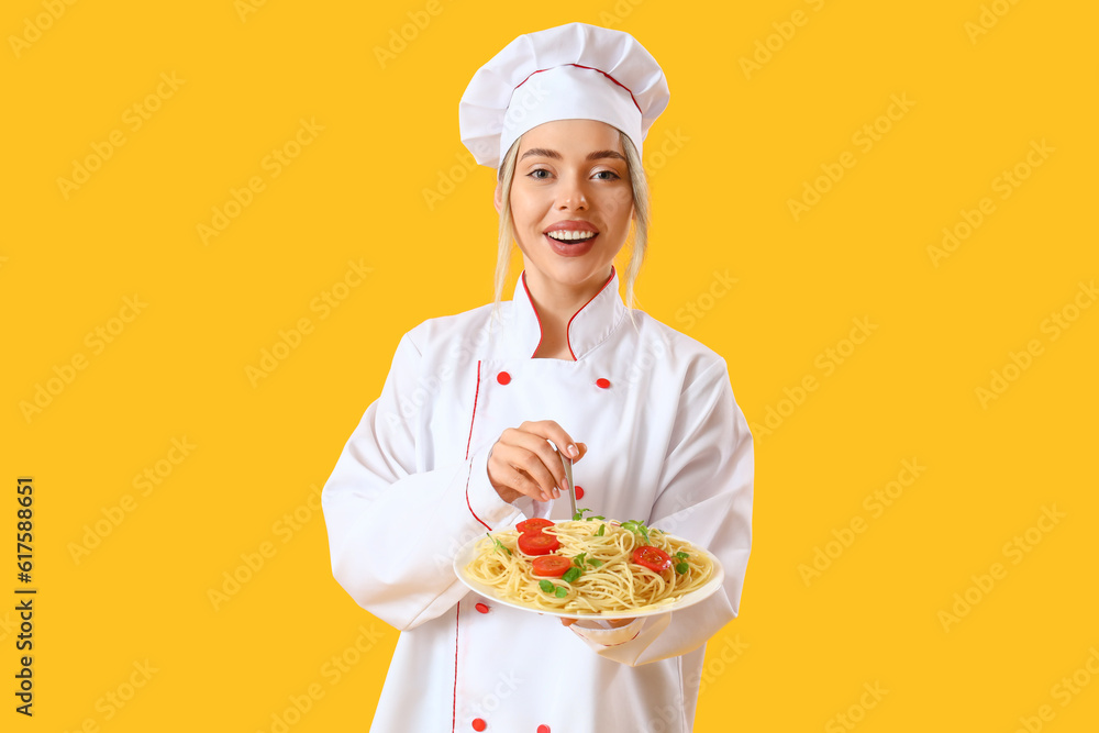 Female chef with tasty pasta on yellow background