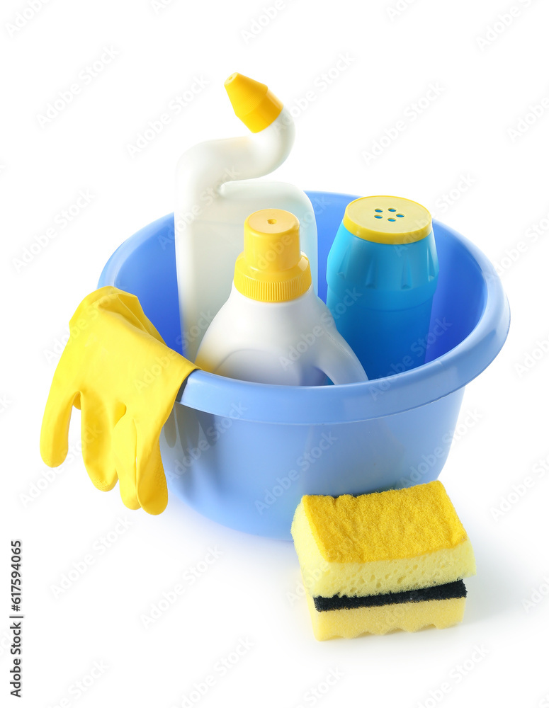 Bowl with different cleaning supplies on white background