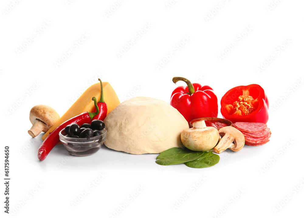 Raw dough and ingredients for preparing pizza on white background