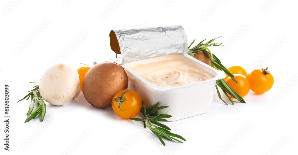 Plastic container with tasty cream cheese, tomatoes and mushrooms on white background