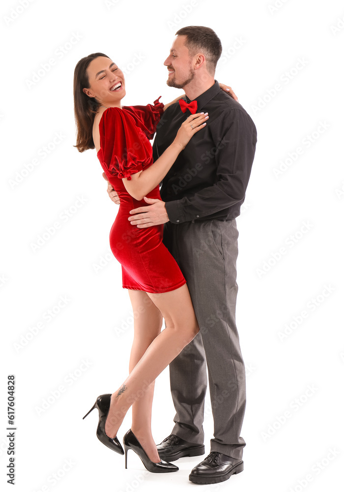 Happy engaged couple hugging on white background