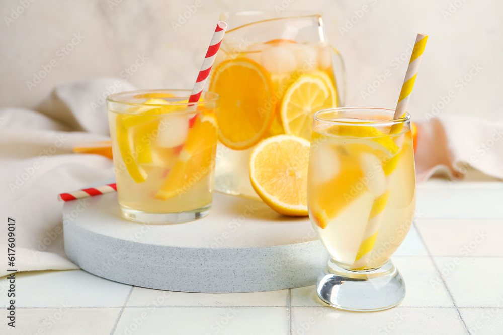 Glasses of infused water with lemon on table