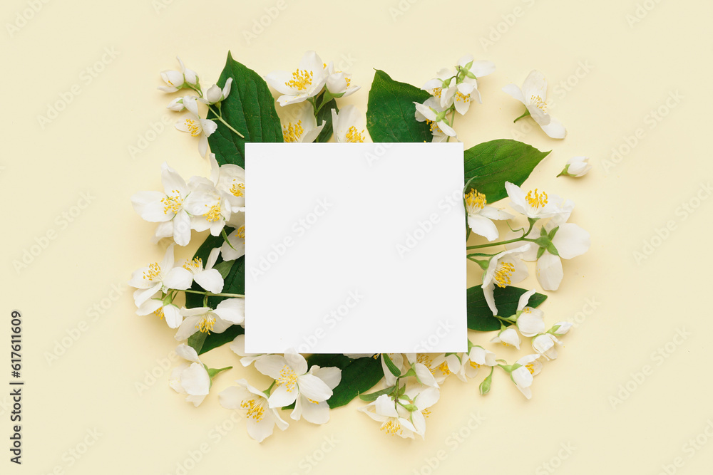 Composition with blank card and beautiful jasmine flowers on color background