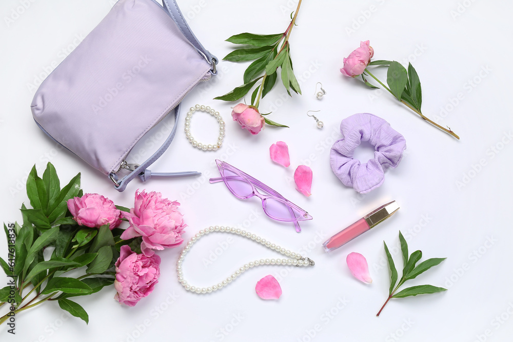 Composition with stylish female accessories, lipstick and beautiful peony flowers on white backgroun