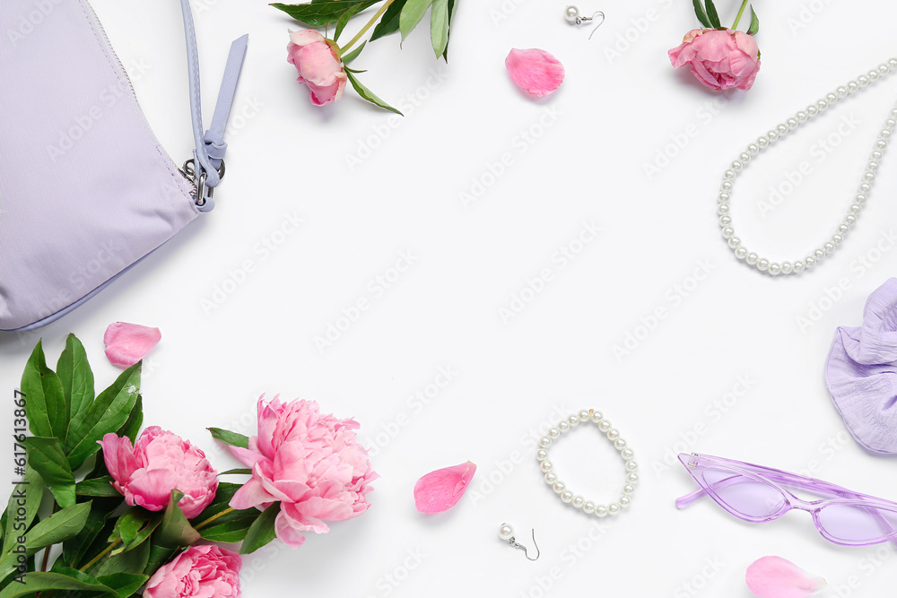 Frame made of stylish female accessories and beautiful peony flowers on white background