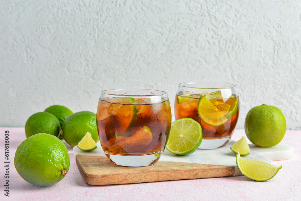 Glasses of cold Cuba Libre cocktail on table