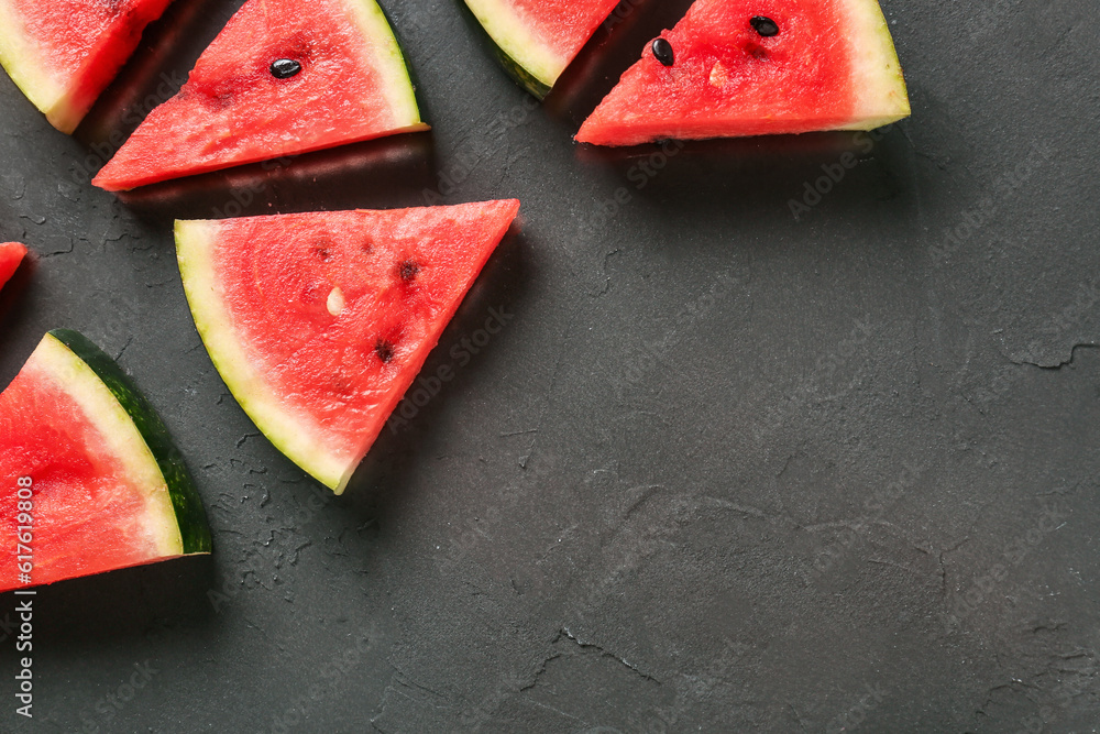 Pieces of fresh watermelon on black background