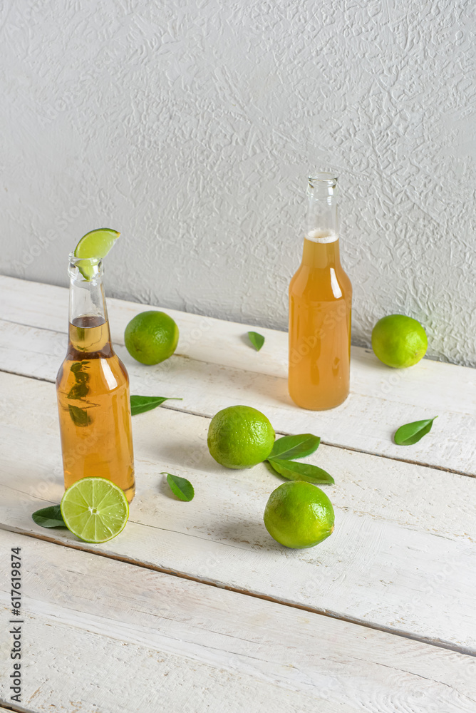 Bottles of cold beer with lime on table