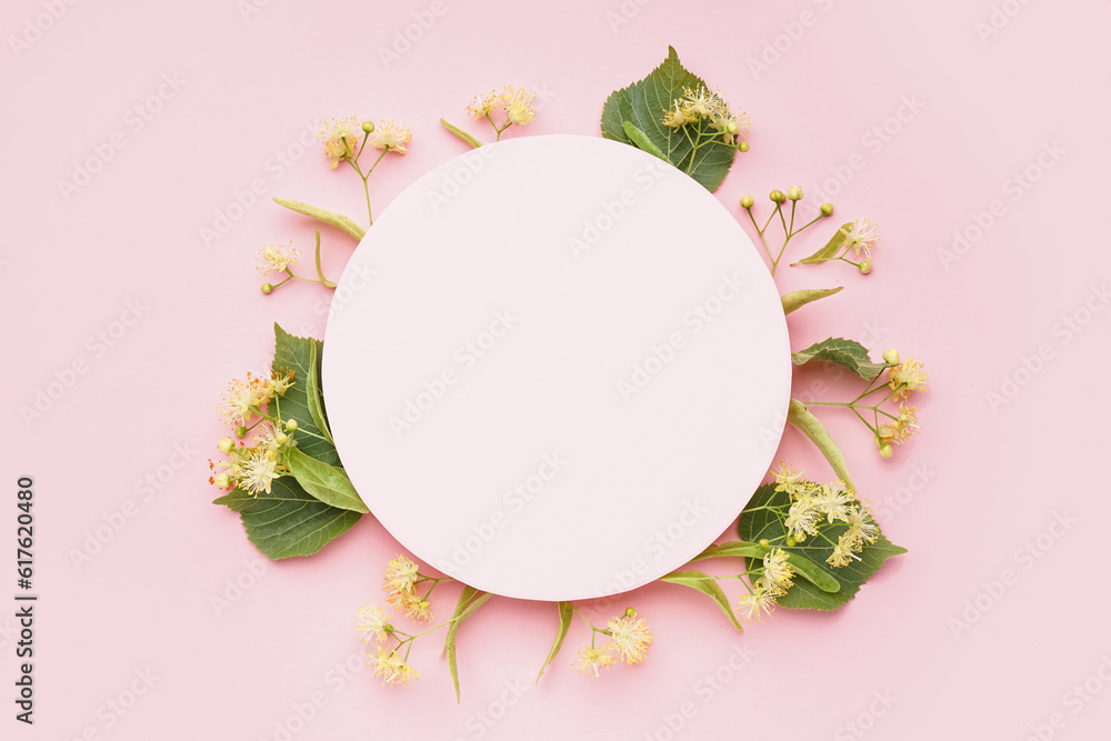 Composition with blank card and fresh linden flowers on pink background