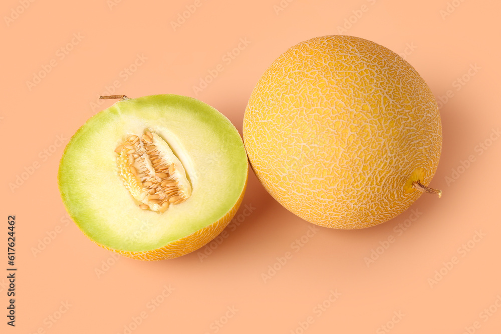 Sweet melon with half on orange background