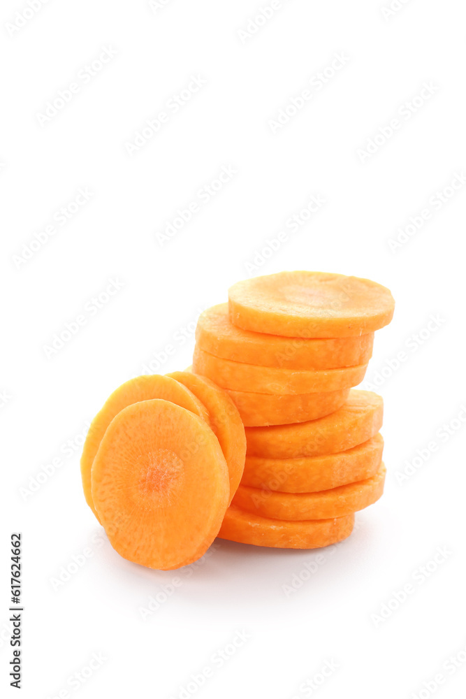 Slices of fresh carrots on white background