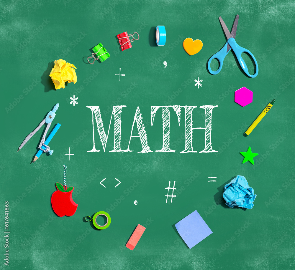 Math theme with school supplies on a chalkboard - flat lay