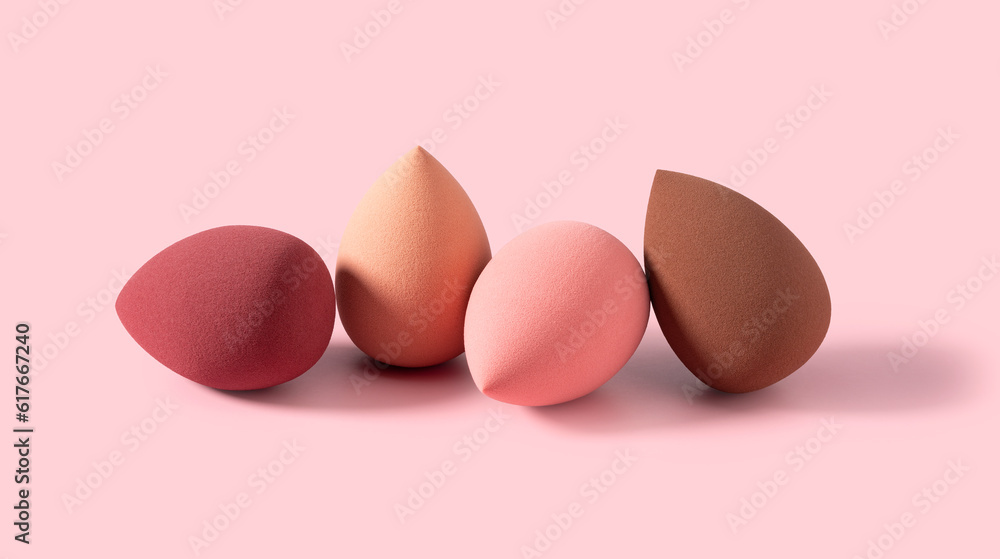 An egg-shaped makeup sponge placed on a pink background.