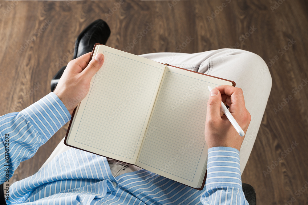 businessman with notepad, works in the office