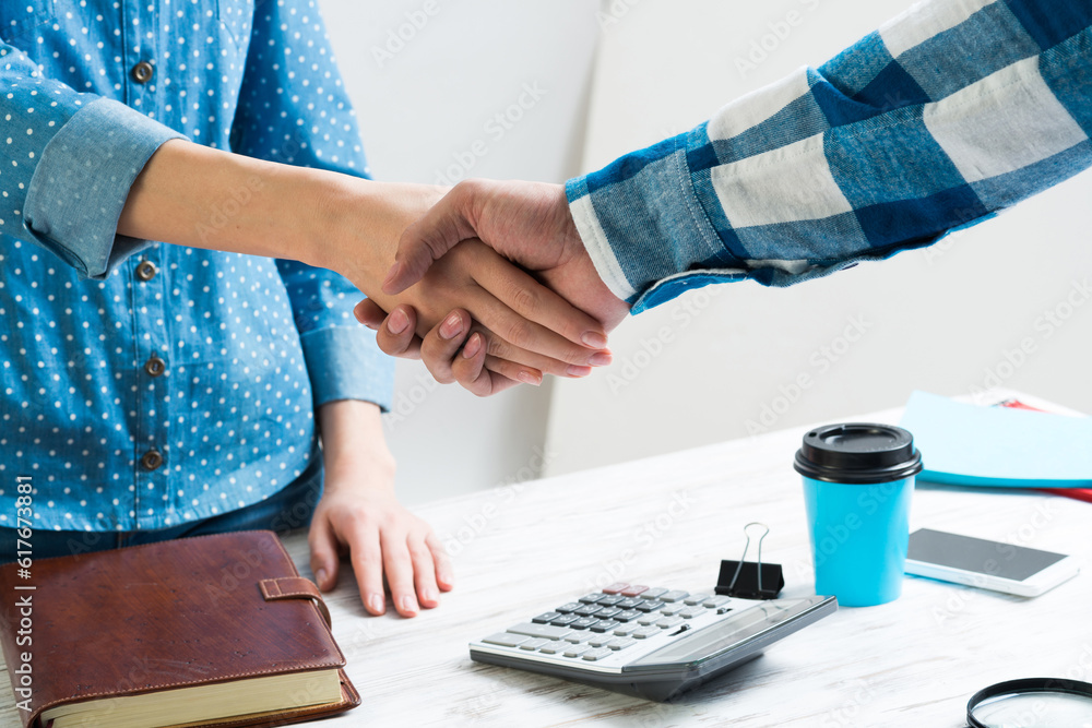 Closeup of male and female hands handshaking