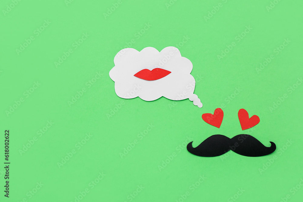 Paper male face and speech bubble with lips on green background. Dialogue concept