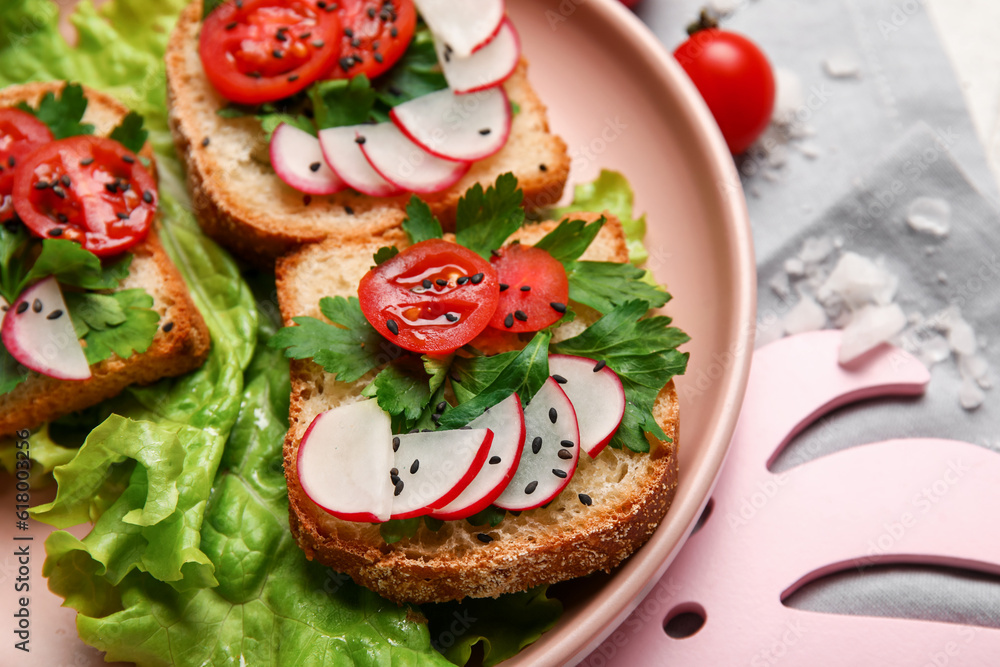 Plate with delicious radish bruschettas, closeup