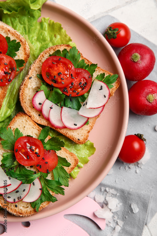 Plate with delicious radish bruschettas, closeup