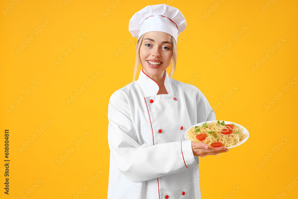 Female chef with tasty pasta on yellow background