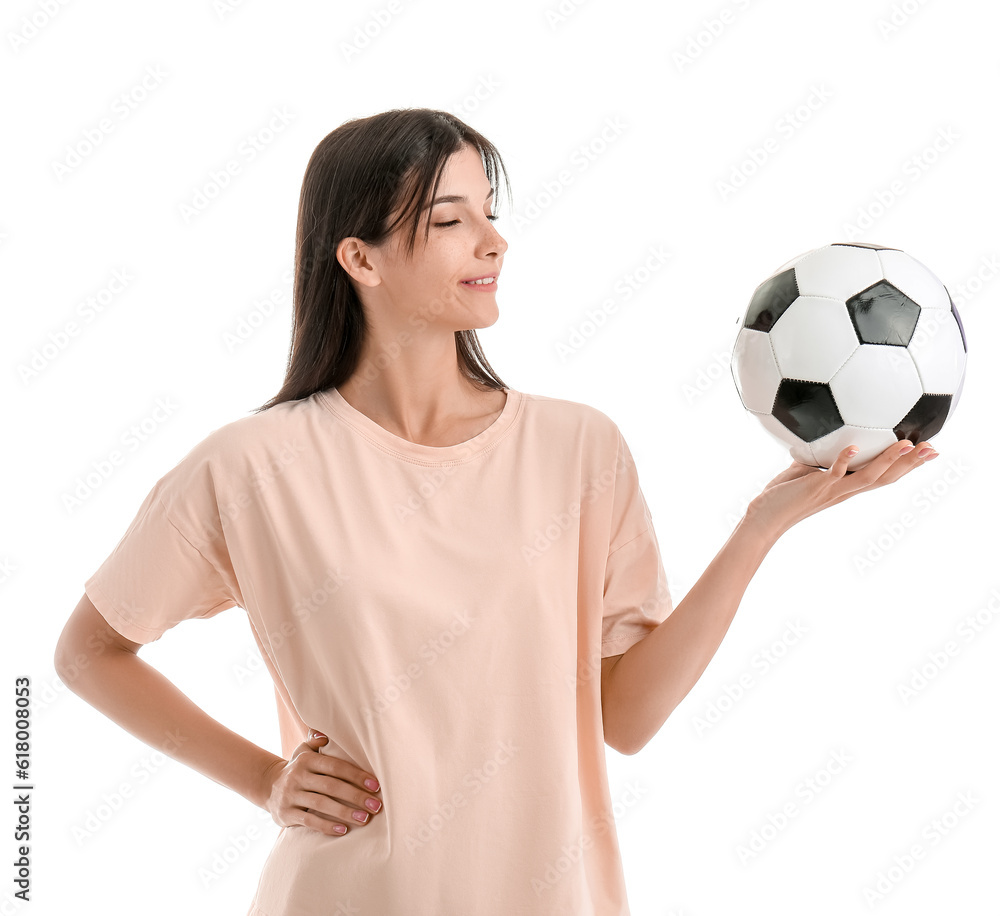 Young woman with soccer ball on white background