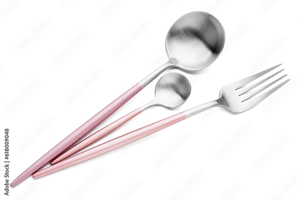 Stainless steel fork and spoons with pink handles on white background