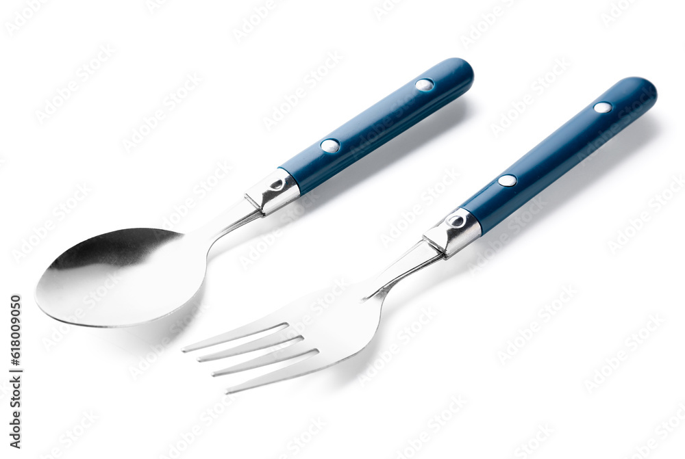 Stainless steel fork and spoon with blue handles on white background