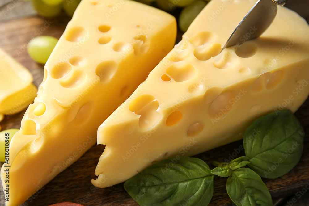 Tasty Swiss cheese on table, closeup