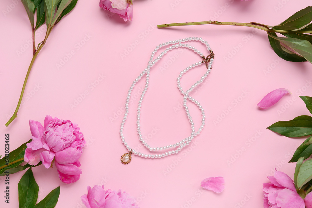 Composition with stylish female necklace and beautiful peony flowers on pink background