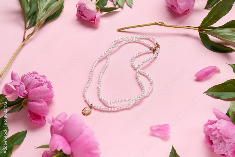 Composition with stylish female necklace and beautiful peony flowers on pink background