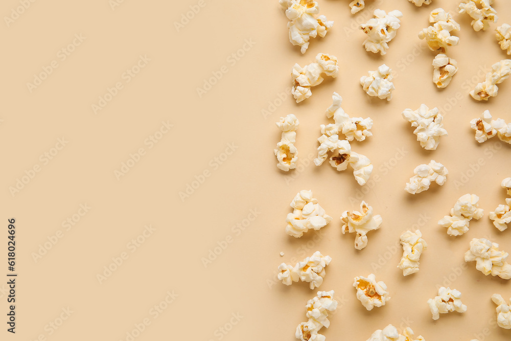 Tasty popcorn on beige background