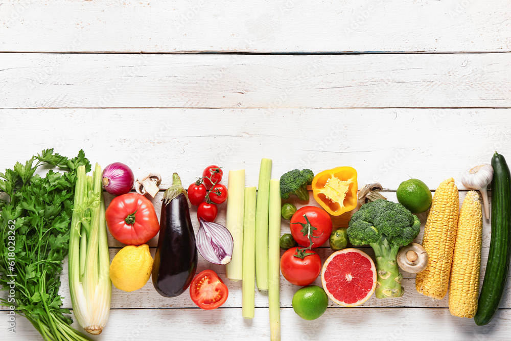 Fresh ripe vegetables on light wooden background