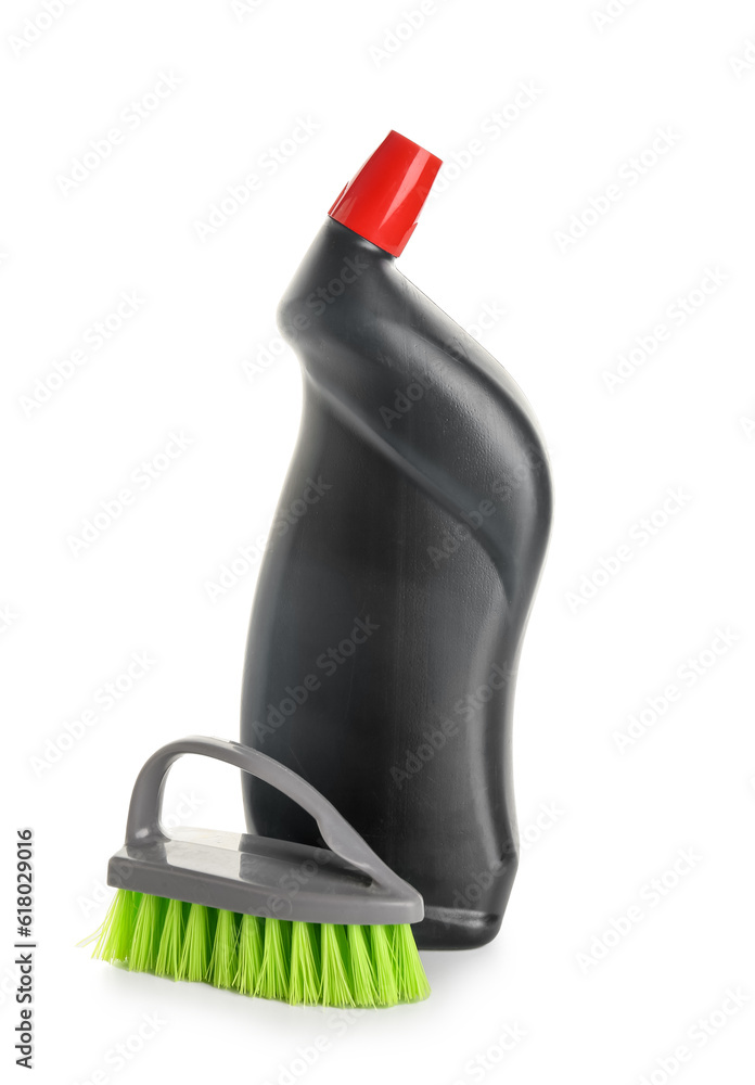 Bottle of detergent and brush isolated on white background