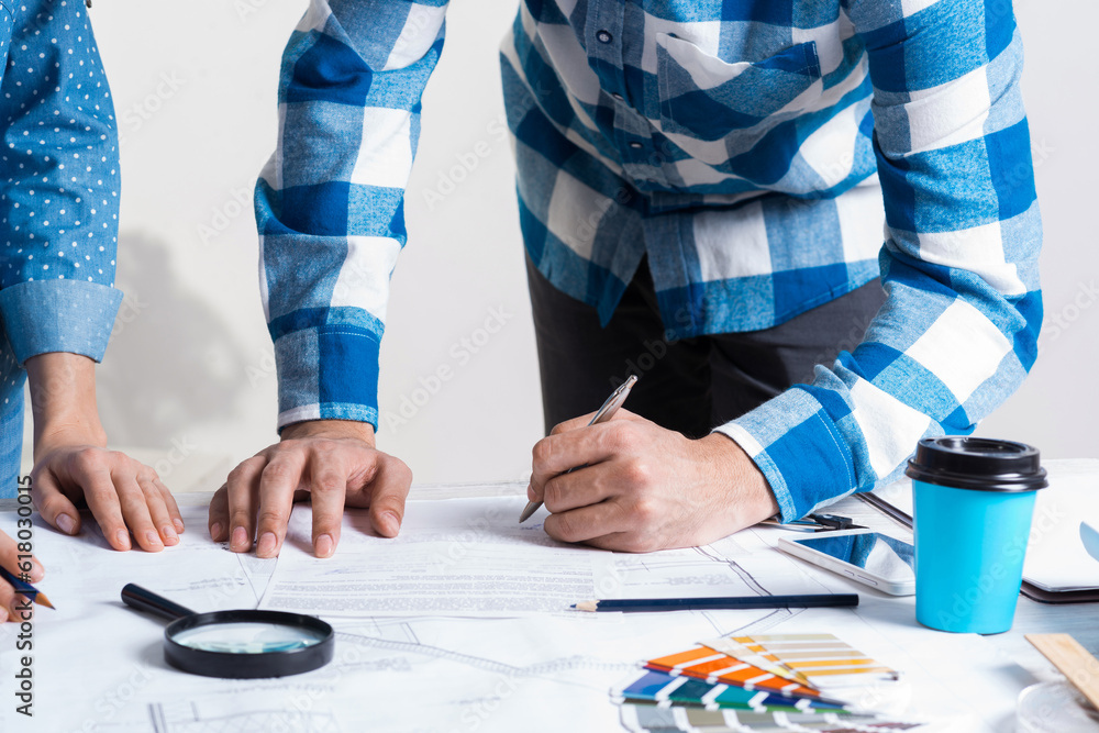 Man carefully studying technical drawing