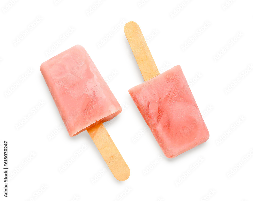 Sweet strawberry ice-cream popsicles on white background