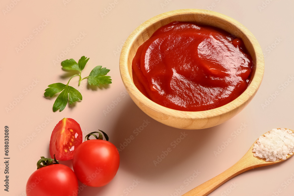 Bowl with tomato paste and fresh vegetables on light background