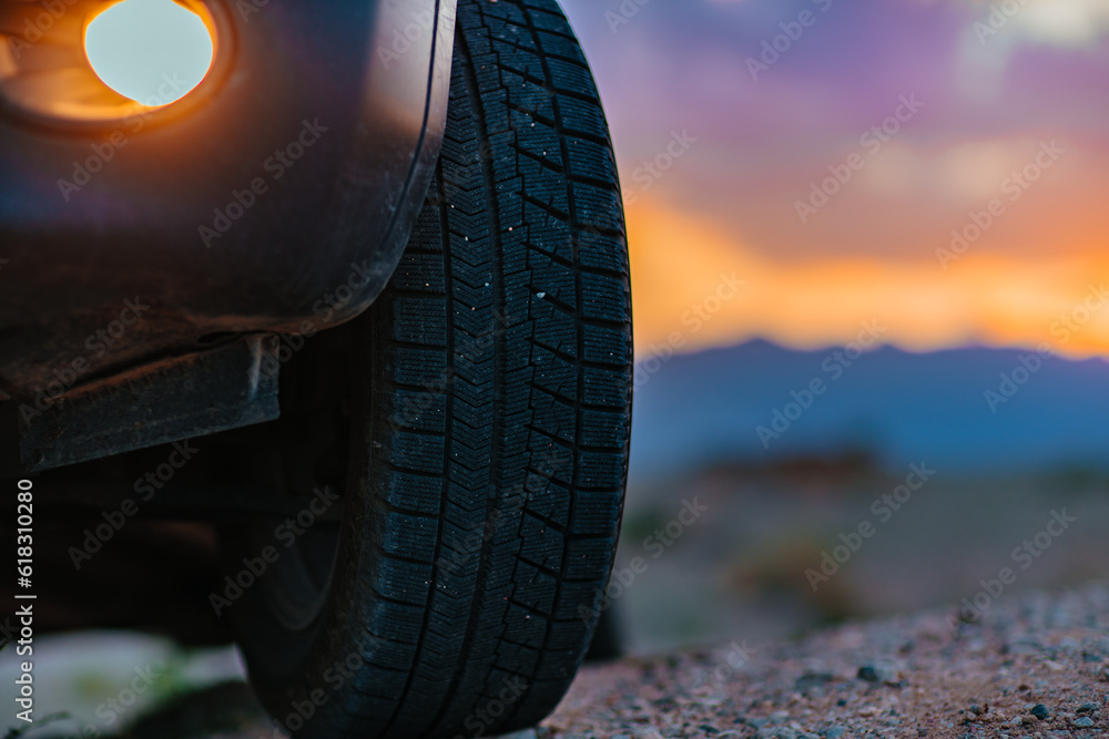 Car wheel offroad closeup view at twilight