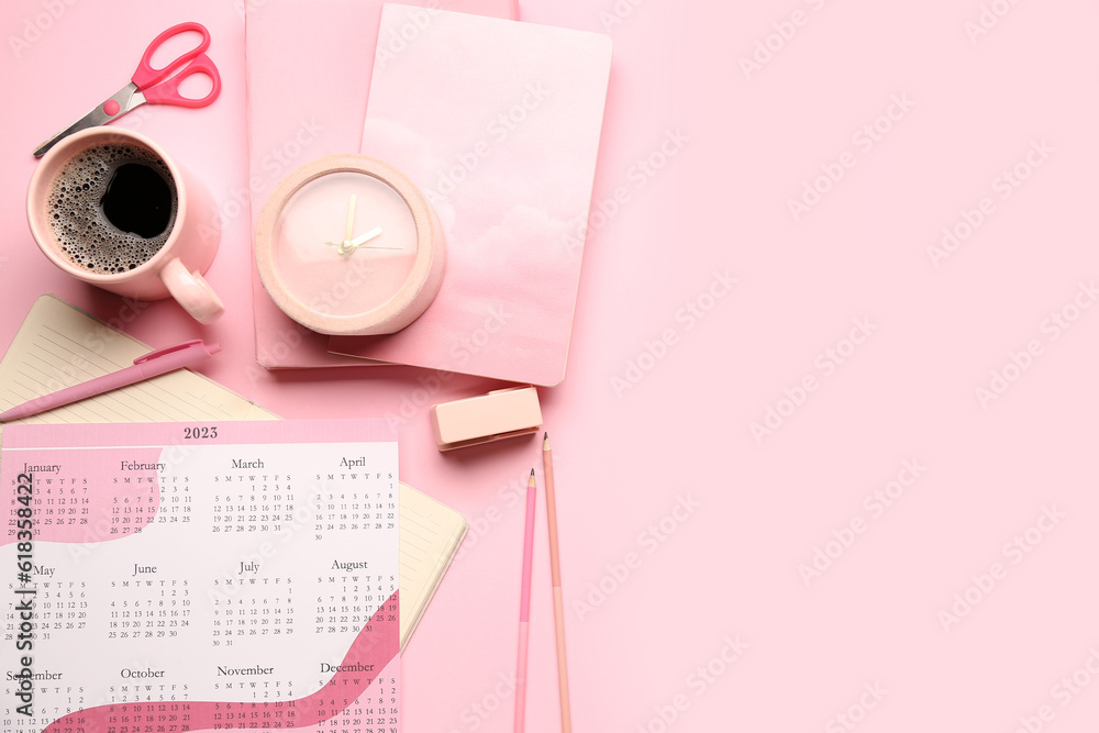 Composition with calendar, cup of coffee, alarm clock and stationary on pink background