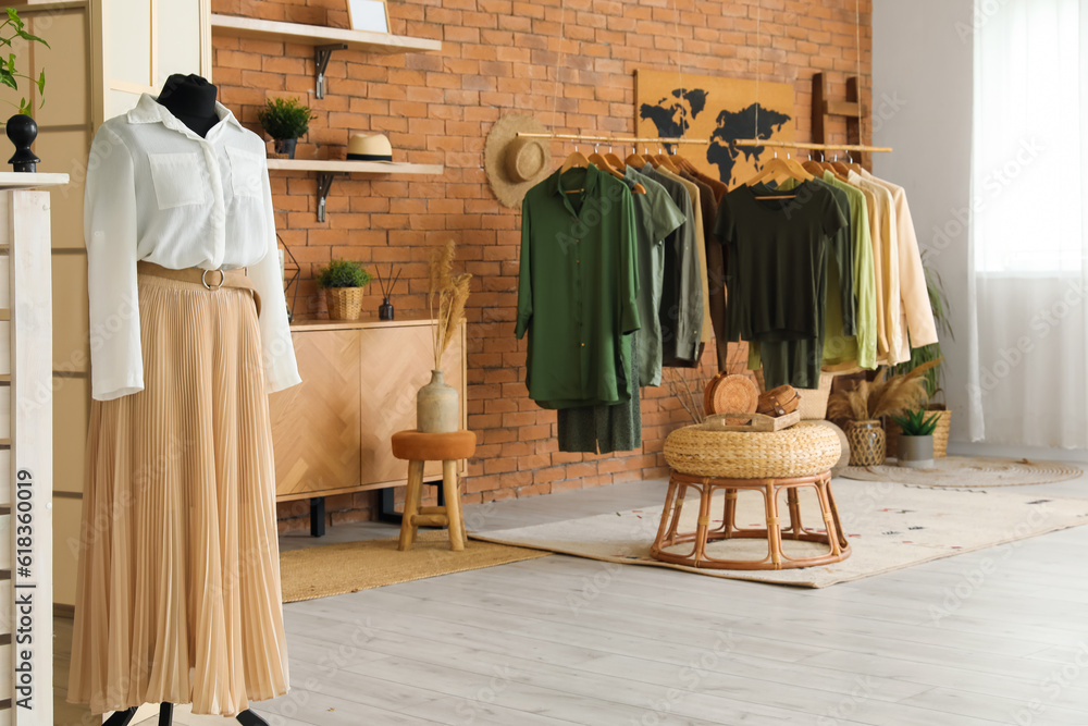 Interior of modern boutique with stylish female clothes and accessories