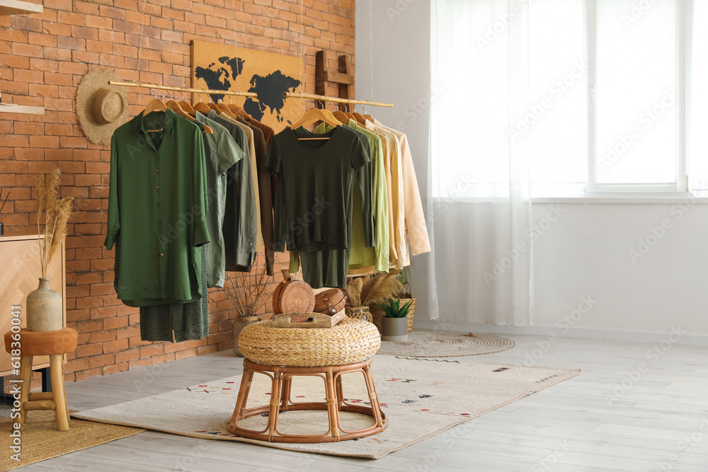 Interior of modern boutique with stylish female clothes and accessories