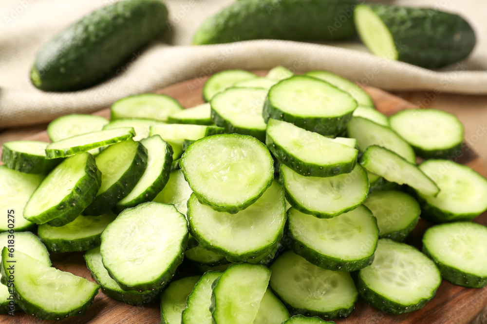 Pieces of fresh cucumber on table, closeup