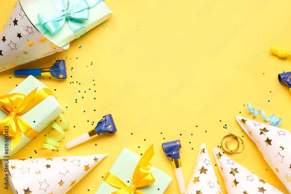 Frame made of many party decor on yellow background