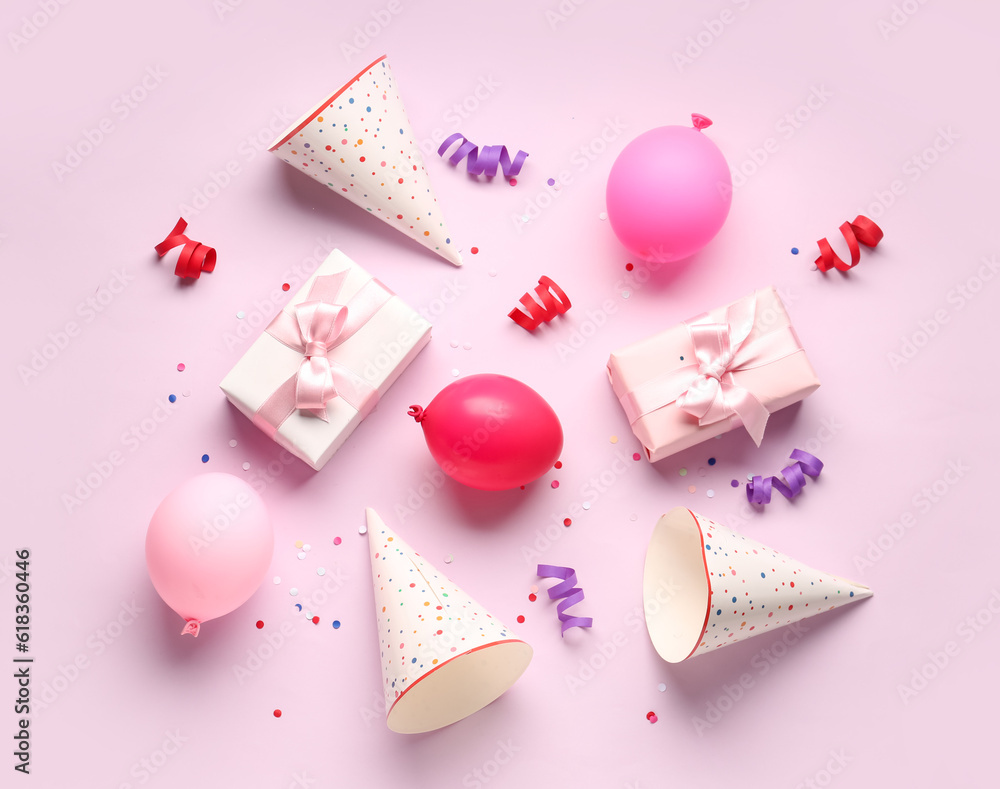 Different party decor on lilac background