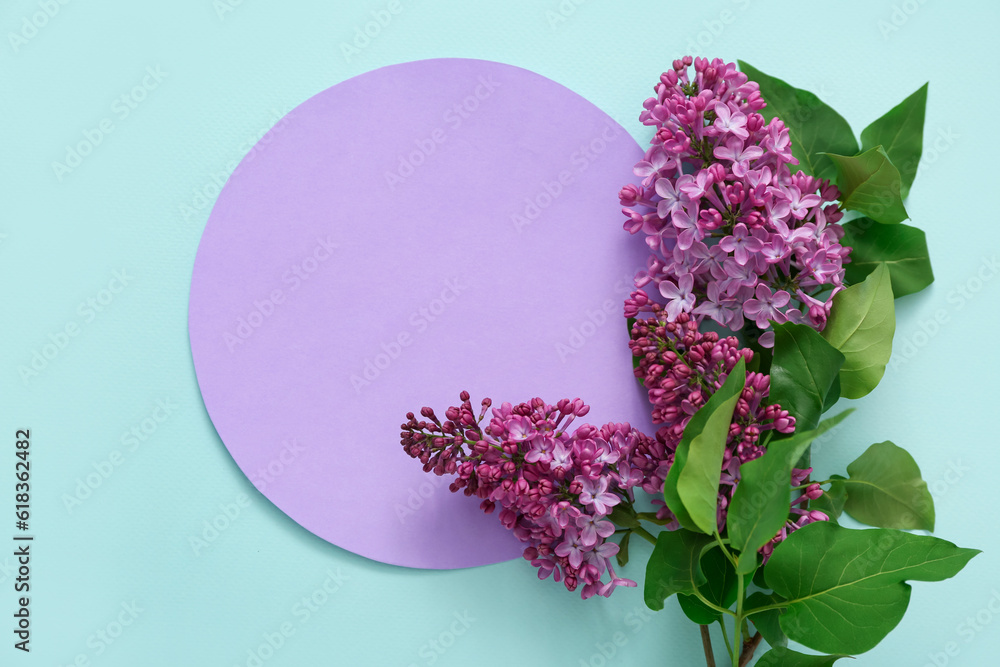 Purple blank card with lilac flowers on pale blue background