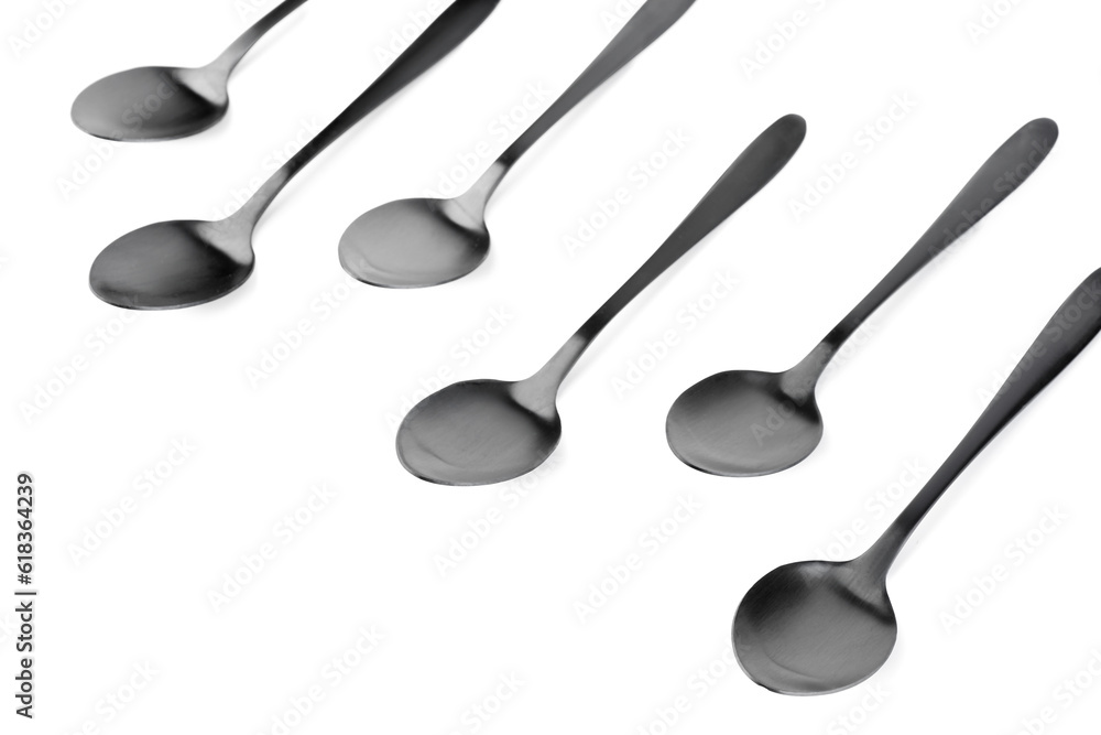 Stainless steel spoons on white background