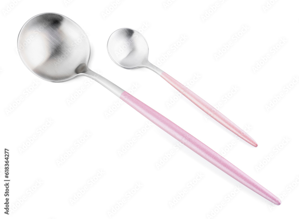 Stainless steel spoons with pink handles on white background