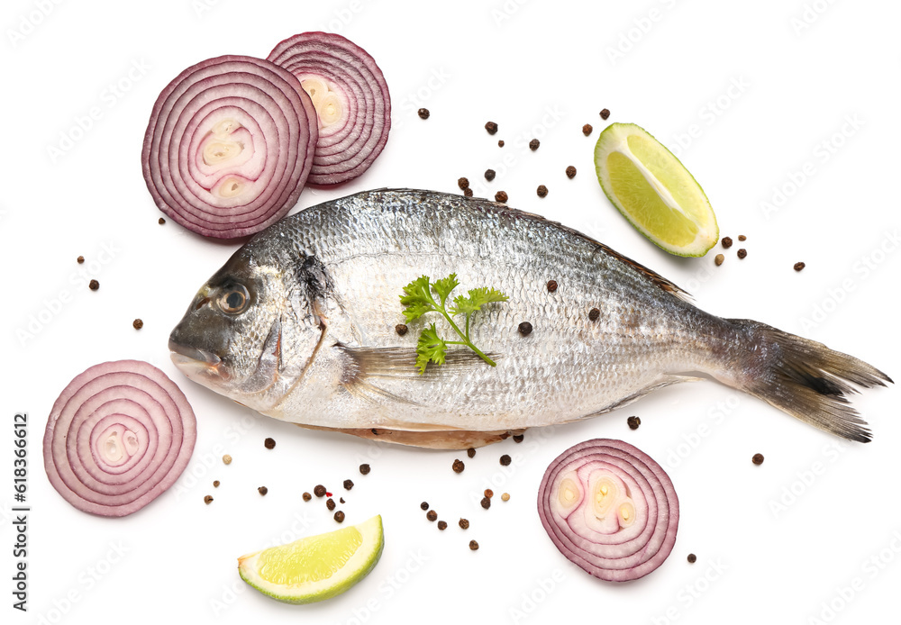 Raw dorado fish with lemon and onion on white background