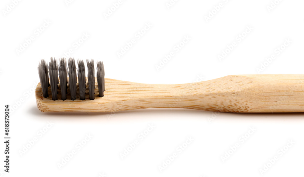 Bamboo tooth brush on white background, closeup