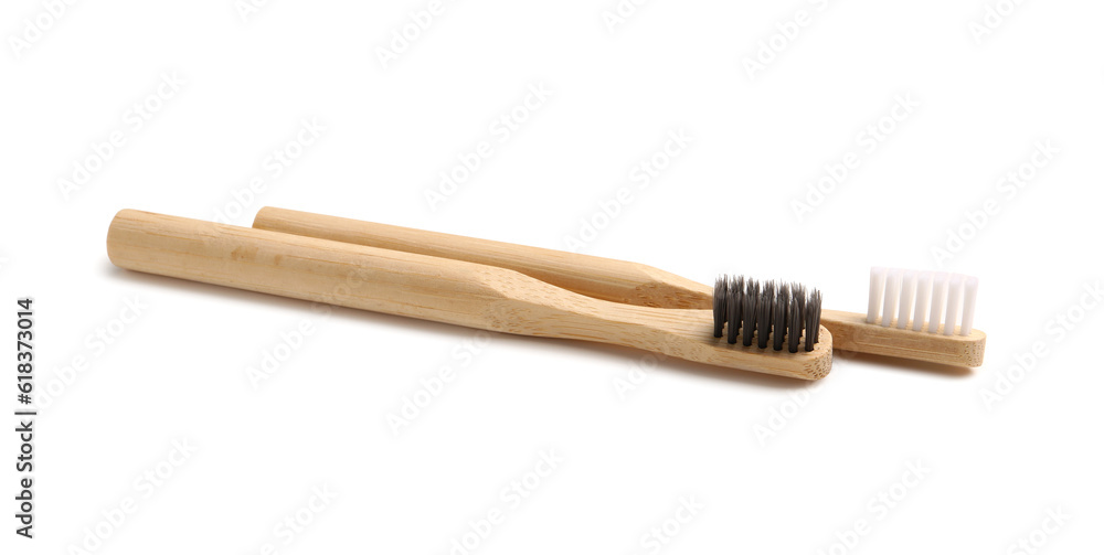 Bamboo tooth brushes on white background