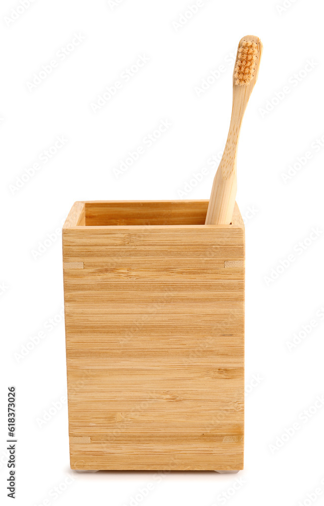 Bamboo tooth brush in holder on white background